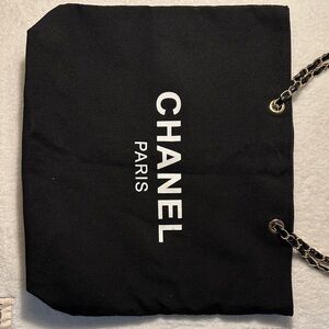 Black canvas tote with Logo on both side and Gold Chain.